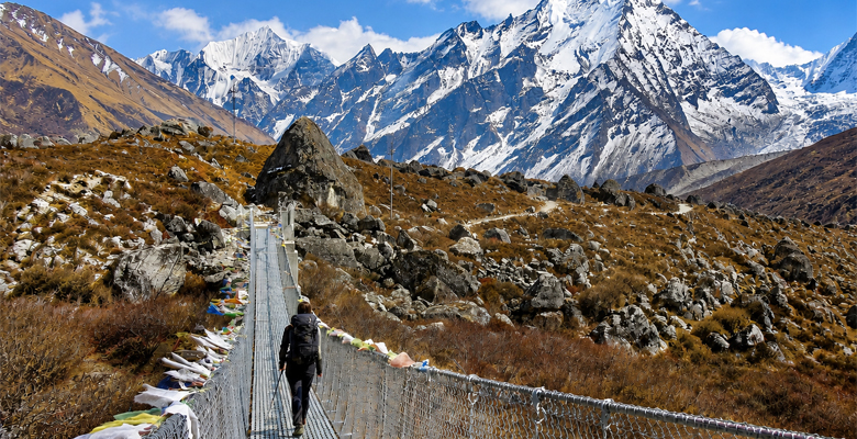 Langtang Valley Trek in Nepal with suspension bridge and Himalayan mountains
